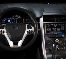 2011 Ford Edge Sport: MyFord Touch redesigns the in-car interface, mirroring how consumers interact with most devices in their lives using touch-sensitive buttons, touch screens, thumb-wheel controls and voice recognition. (02/10/2010)