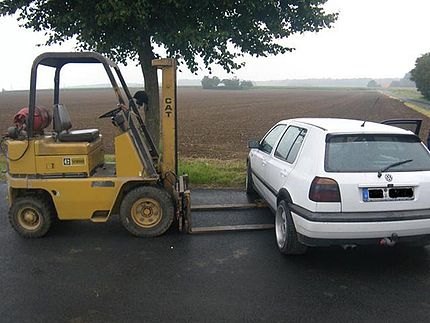 FORKING IDIOT A drunk driver who crashed his car after a night on the town tried to sneak it home without alerting the police – on a stolen forklift truck. Marus Schmidt, 27, from Bedburg, Germany, was caught trying to load the pranged Volkswagen Golf onto the forklift while he was nearly twice the legal…