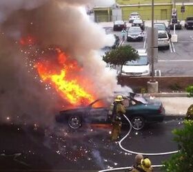watch as a burning car explodes in a firefighter s face video