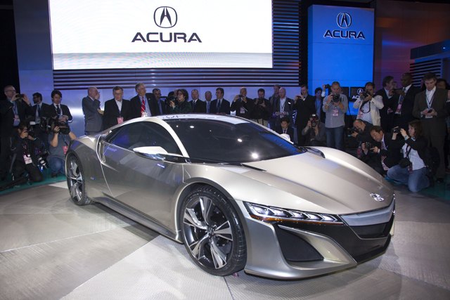 Automotive media gather around the all-new Acura NSX Concept that debuted at the 2012 North American International Auto Show in Detroit.