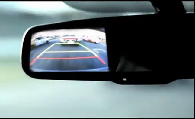 Kia Shows Off Rear-View Cameras With Reverse Only Race | AutoGuide.com