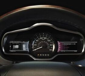 2013 Lincoln MKT: The all-new instrumentation of MyLincoln Touch(TM) in the 2013 Lincoln MKT features a central speedometer flanked by two full-color reconfigurable LCD screens. The 4.2-inch LCD screens are controlled by five-way buttons on the steering wheel. (11/17/2011)