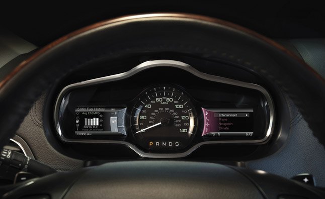 2013 Lincoln MKT: The all-new instrumentation of MyLincoln Touch(TM) in the 2013 Lincoln MKT features a central speedometer flanked by two full-color reconfigurable LCD screens. The 4.2-inch LCD screens are controlled by five-way buttons on the steering wheel. (11/17/2011)