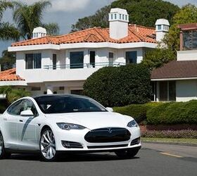 Tesla Shares Jump 24% After Maker Reports Profit