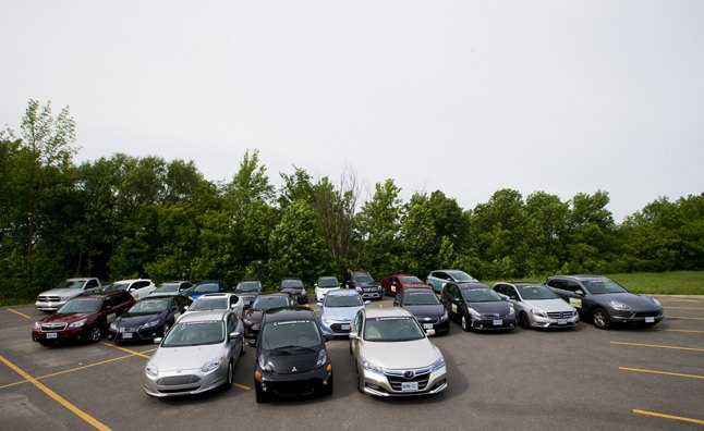 Twenty-two fuel-efficient vehicles are parked in Saint-Eustache, Quebec during the Automobile Journalists Association of Canada's 2013 Eco Run on Wednesday, June 5, 2013. (Michelle Siu for AJAC)