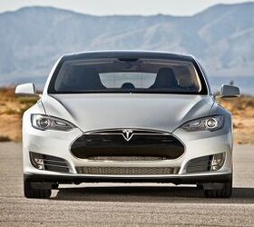 Tesla Added to Nasdaq-100 Index, Shares Hit New Peak