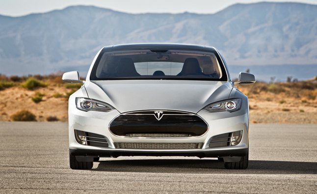 Tesla Added to Nasdaq-100 Index, Shares Hit New Peak