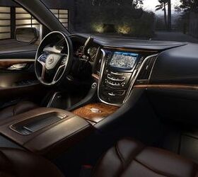 The 2015 Cadillac Escalade's all-new interior combines luxurious handcrafted elements, shown here in Kona/Ebony with elm cluster open-pore wood trim.
