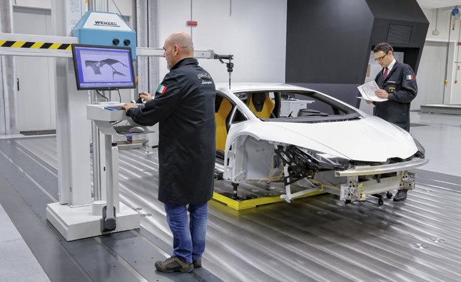 Lamborghini engineers using their latest toy, performing 3D quality control checks on components for the new Hurecan.