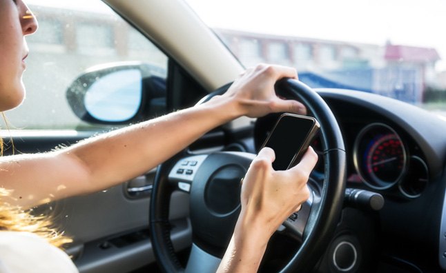 Female driver texting
