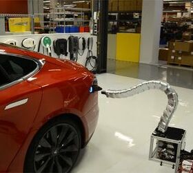 Tesla Shows Off Creepy Automated Charger Prototype