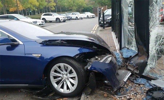 Tesla Flies Through the Air, Drives Over Mercedes, Crashes Into Dealership