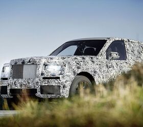 rolls royce offers first look at its upcoming suv