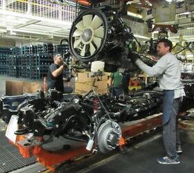 6.6L Duramax Diesel engine being placed in chassis at engine set for GM's Heavy Duty pickups. General Motors Flint Assembly/UAW Local 598 in Flint, Michigan. (Photo: General Motors)