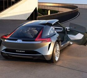 Buick Wildcat EV concept rear three-quarter with distinctive semi-swing doors that open on the passenger side.