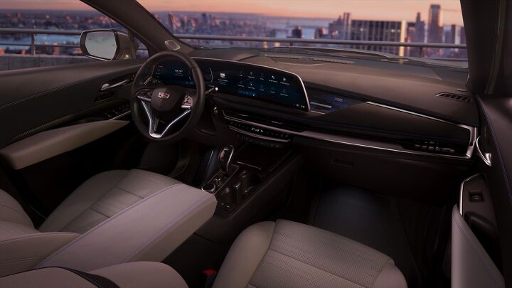 Passenger side dash view of the fresh new interior design in the 2024 Cadillac XT4, featuring the signature AKG audio system and the LYRIQ-inspired 33-inch-diagonal interface and display with 9K resolution.
