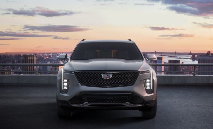 The front fascia of the 2024 Cadillac XT4 features the unmistakable Cadillac vertical light signature, sleek LED headlamps and a new grille design with a modern reinterpretation of the classic Cadillac chevron. Shown here in Argent Silver Sport.