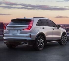 Rear 3/4 shot of the 2024 Cadillac XT4 in Argent Silver Sport featuring the updated modern rear design and all-new available 20-inch alloy wheels.