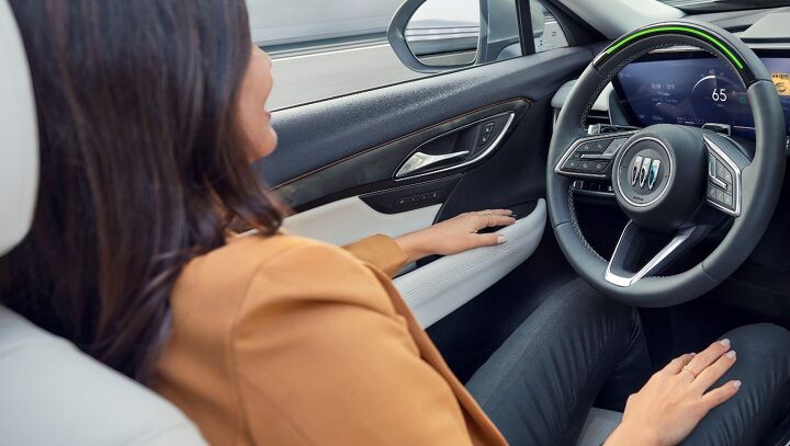 Interior of the 2024 Buick Envision Avenir, showcasing a redesigned steering wheel with Super Cruise engaged. The 2024 Envision will be the first Buick in North America to offer Super Cruise.