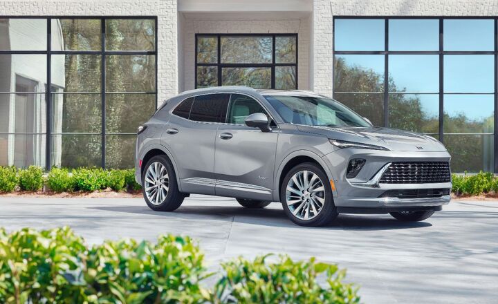 Front 3/4 view of the 2024 Buick Envision Avenir in Moonstone Gray Metallic. Preproduction model shown. Actual production model may vary. Available in Q1 of 2024.