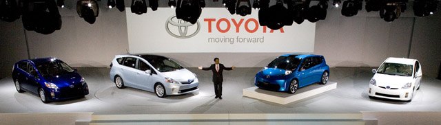 Akio Toyoda, President of Toyota Motor Company presents the Prius family vehicles prior to their intoduction, Monday, January 10, 2011 at the North American International Auto Show in Detroit, MI. The Prius family (L-R), current third-generation Prius, Prius v, an all-new dedicated midsized hybrid vehicle and the Prius Plug-in Hybrid Vehicle (PHV). Photo by: Joe…