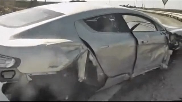 watch an aston martin rapide wrecked from the passenger seat video