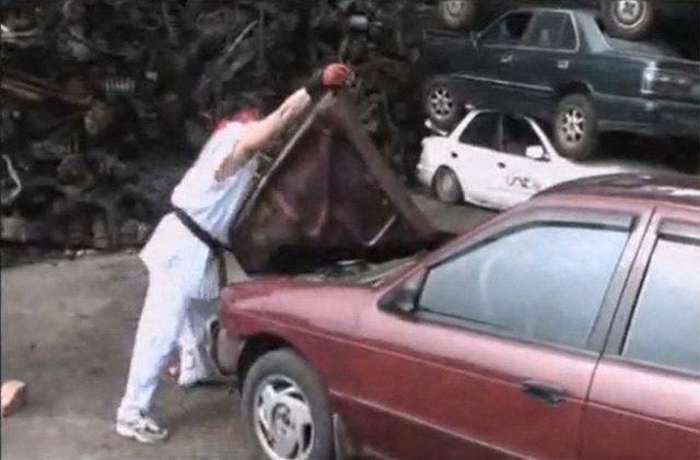 costumed street fighter ryu destroys a car with his bare hands video