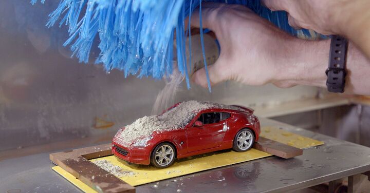 Why Nissan Has a Little Machine for Washing Diecast Cars