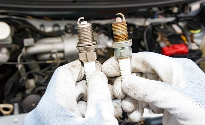 A new spark plug next to an old one that needs replacing. Photo Credit: stella_photo/Shutterstock