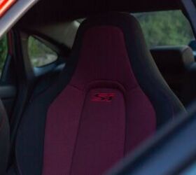 Unique to the Si model are custom sporty seats with a black and red treatment. They include "Si" stitching just below the headrest.
