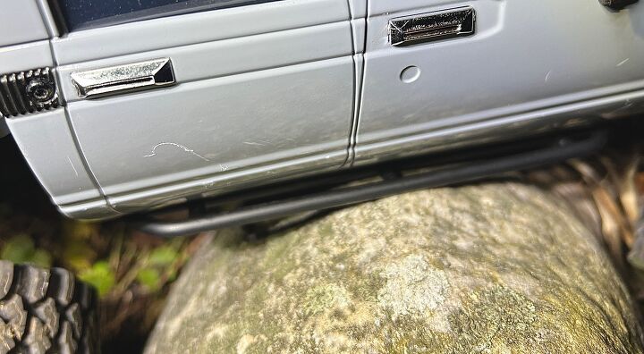 Without metal between the rock and the door, the body panel would take on the damage rather than the slider. Photo Credit: Ross Ballot
