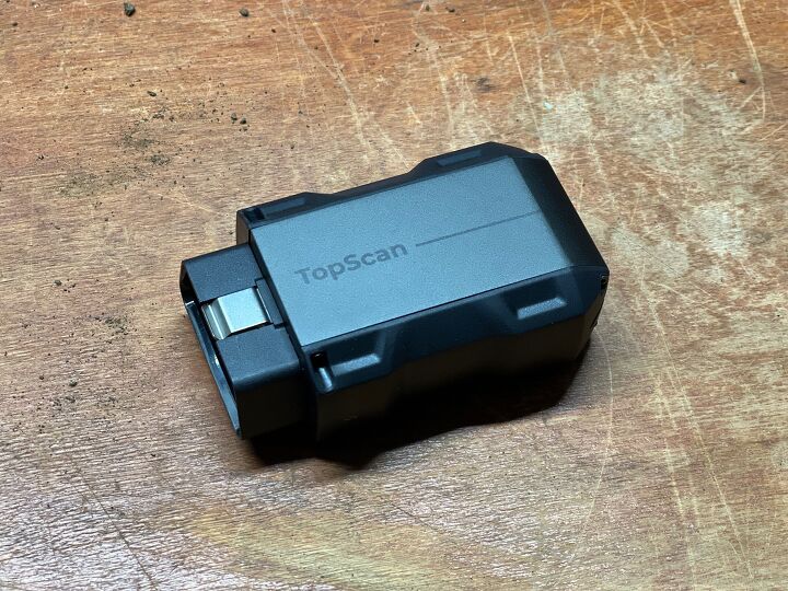 The tiny Bluetooth module plugs into the vehicle's OBD2 port and pairs with a smartphone. Photo Credit: Ross Ballot