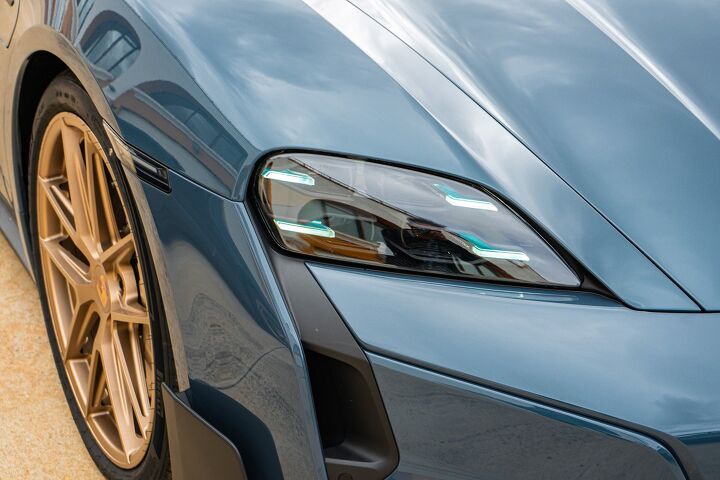 The bronze wheels on the 2025 Porsche Taycan Turbo GT look great when contrasted with the Pale Blue Metallic exterior paint