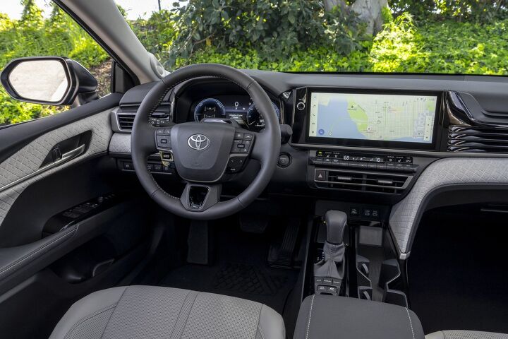 The Camry XLE adds a swanky quilted Dinamica material across the cabin. Image credit: Toyota