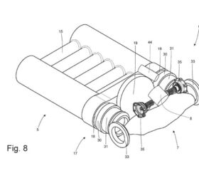 The opposed piston engine and transaxle assembly. Note the centrally mounted wheel between the crankshafts providing input to the transaxle.