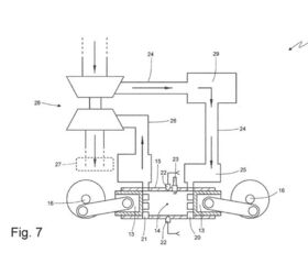 The opposed piston engine when viewed from the rear. Each side of the cylinder has an intake runner and spark plug. 