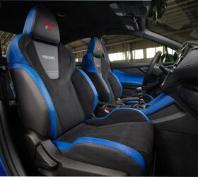 The large Recaro buckets are trimmed in suede with blue accents