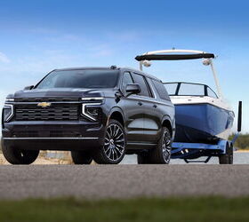 2025 Chevrolet Suburban High Country towing a boat