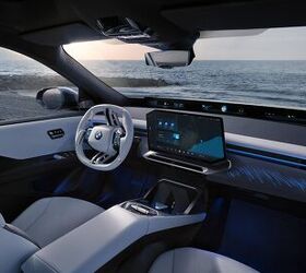 Minimalist interior of the 2026 BMW iX3 with its main screen and 'shy tech' philosophy.