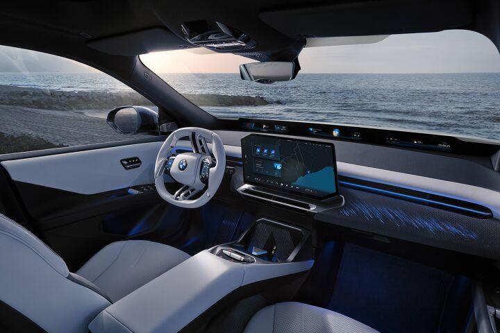 Minimalist interior of the 2026 BMW iX3 with its main screen and 'shy tech' philosophy.